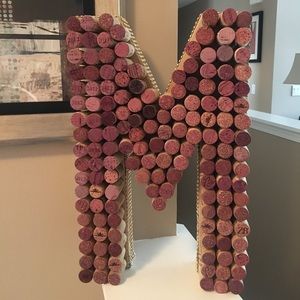 Cork letter “M” with gold and diamond ribbon